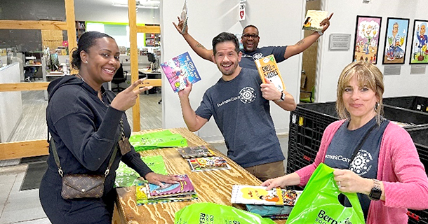 Employees packing books at Bernie's Book Bank.